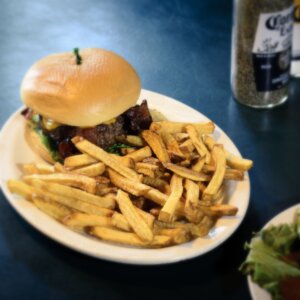 A burger with fries at Dirtwater Springs, a top place to eat in Apache Junction, AZ.