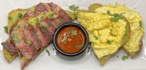 Eggs and steak on toast, a popular menu item on local places to eat in Apache Junction.