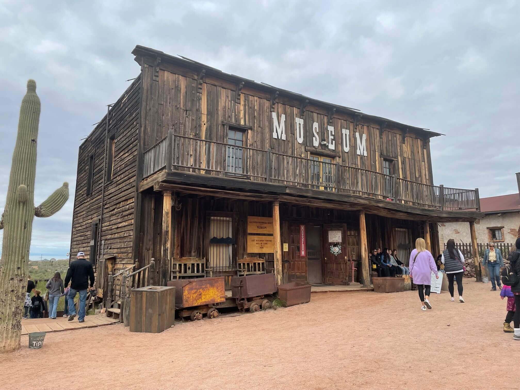 The Goldfield History Museum stands alongside cacti, a popular day trip destination from Phoenix.