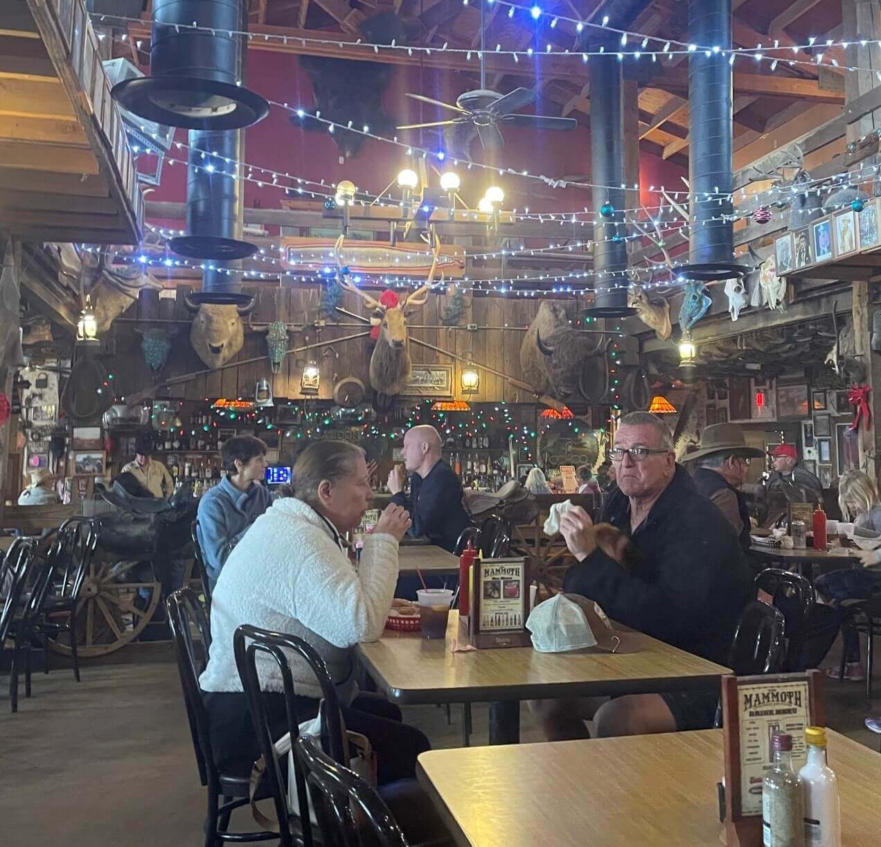 Visitors enjoy food and drink inside Mammoth Steak House, a popular place to eat in Goldfield.