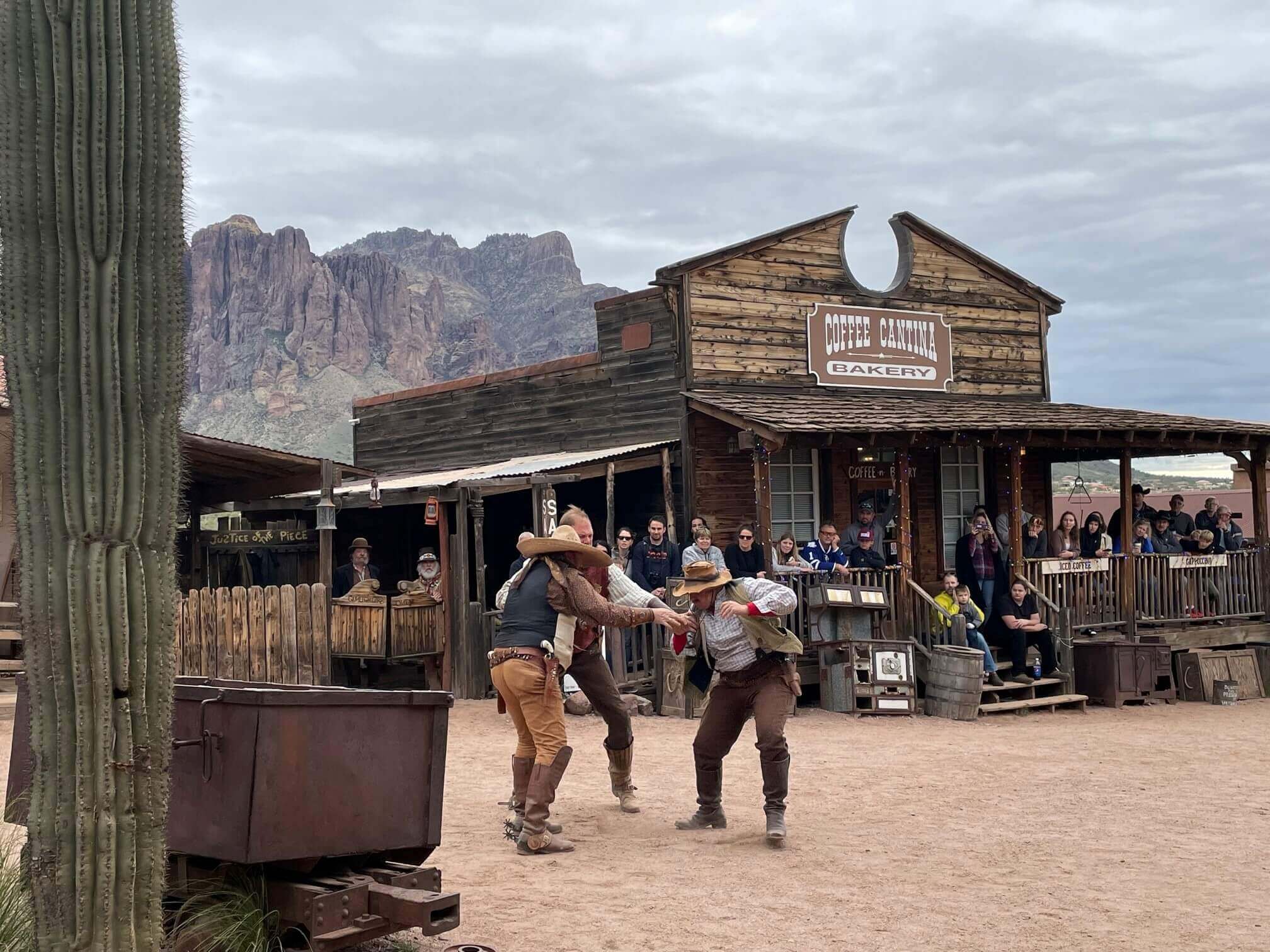 Actors reenact a western shootout during a day trip to Goldfield ghost town.