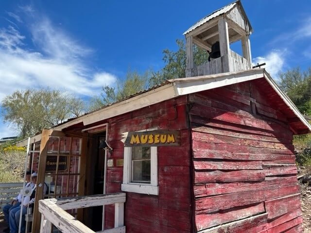 A red barn with a sign for the Museum at Tortilla Flat, an old Arizona ghost town.